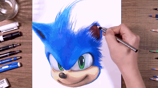 a person is drawing a picture of sonic the hedgehog with a pencil