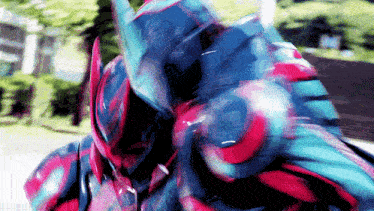 a close up of a person wearing a blue and red costume