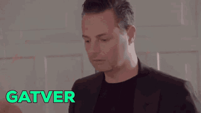 a man and a woman are standing next to each other and the word gatver is on the screen
