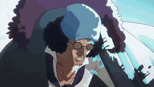 a man wearing a blue hat and glasses stands in front of a purple and white background