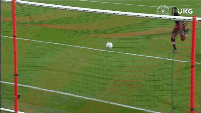 a soccer player with the number 24 on his shirt is laying on the ground