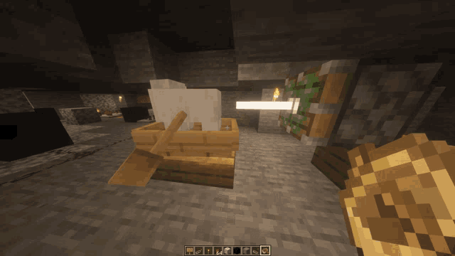 a screenshot of a minecraft game shows a wooden bucket and a candle
