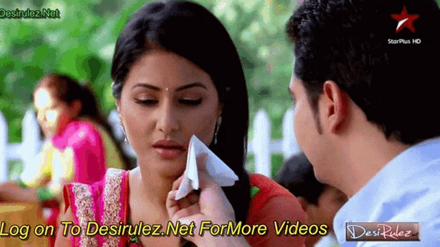 a man wipes a woman 's face with a napkin and the words log on to desirulez net for more videos