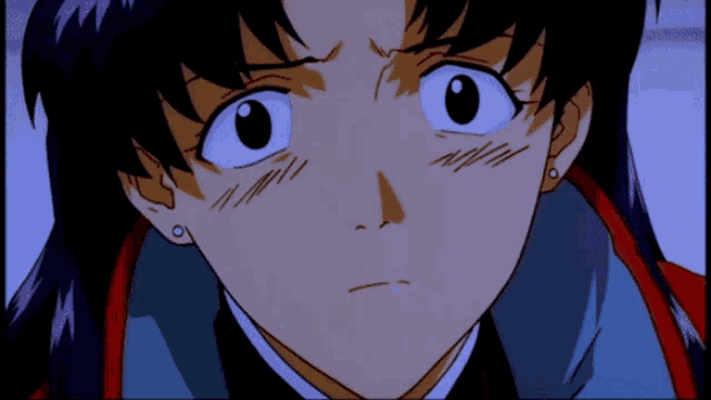 a close up of a girl 's face with a very serious look on her face
