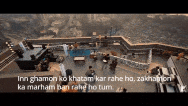 a group of people on a rooftop with the words inn ghamon ko kham kar rahe ho
