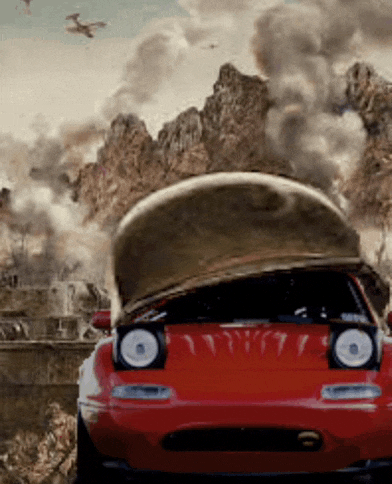 a red sports car with the hood up and a helmet on top of it