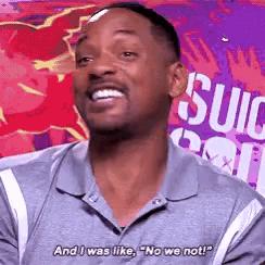 a man in a gray shirt is smiling and saying " and i was like "