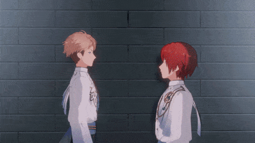 a man with red hair and a woman with blonde hair standing back to back