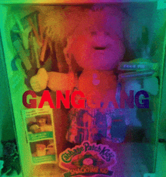 a cabbage patch kid doll in a box with the word ganggang on it