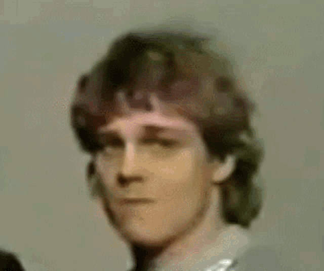 a close up of a man 's face with yep written on the bottom