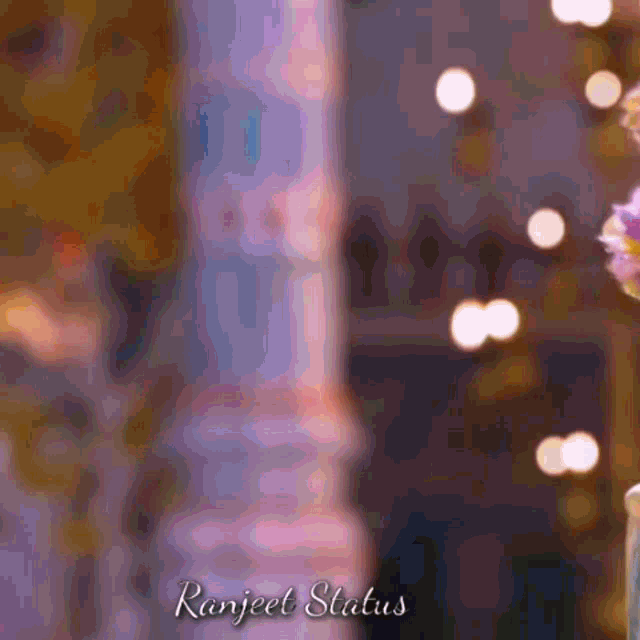 a purple background with the words ranjeet status at the top