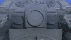 a large ship is floating in the ocean with a pink light coming out of the top of it