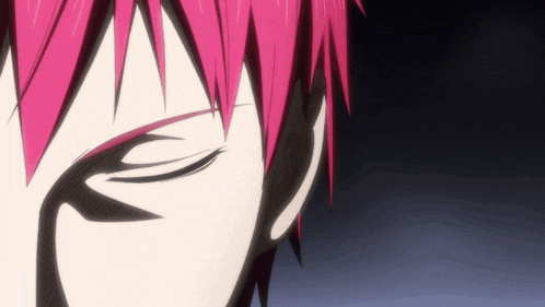 a closeup of a person 's face with pink hair