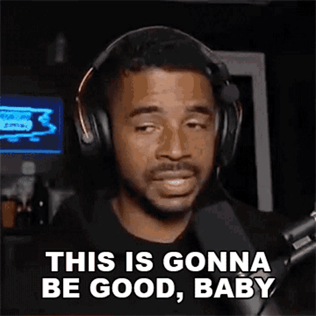 a man wearing headphones is standing in front of a microphone and says `` this is gonna be good , baby '' .