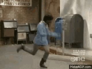 a man is running in front of a mailbox in a building .