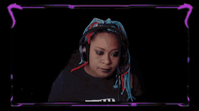 a woman wearing headphones and a t-shirt that says freedom