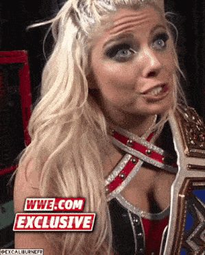 a female wrestler with a wwe.com exclusive logo in the corner
