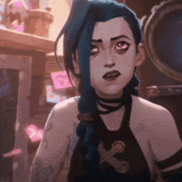a girl with blue hair and a tattoo on her arm is looking at something