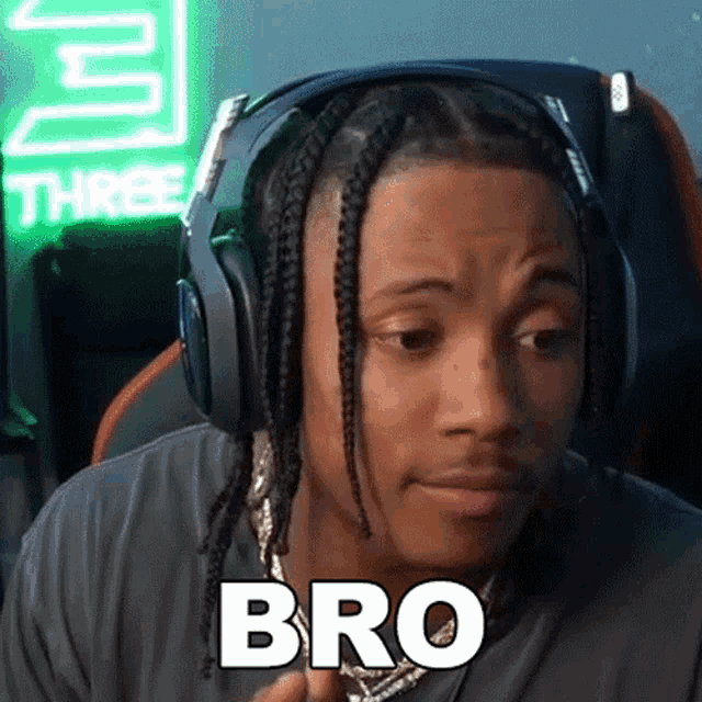 a man wearing headphones is making a face and saying bro .