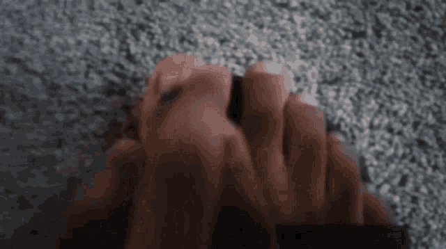 a close up of a person 's feet on a gray carpet