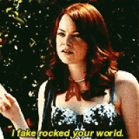 a woman says i fake rocked your world in front of a tree