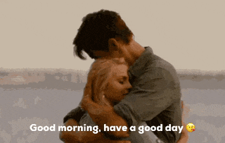 a man is hugging a woman with the words good morning have a good day below them