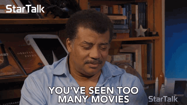 a man says " you 've seen too many movies " while sitting in front of a bookshelf