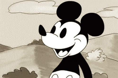 a black and white cartoon of mickey mouse standing in a field
