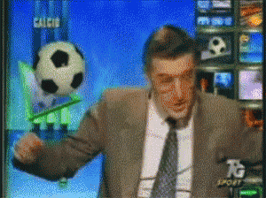 a man in a suit and tie is holding a soccer ball in front of a tv screen that says calcio