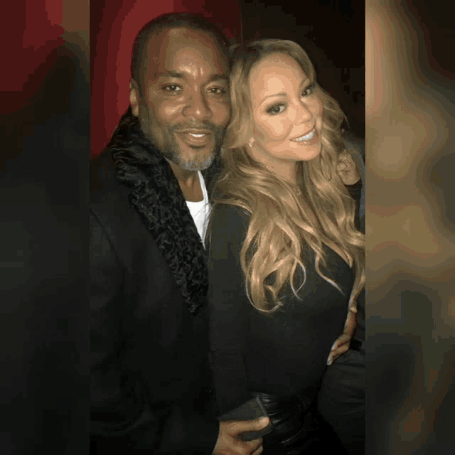 a man and a woman pose for a photo together