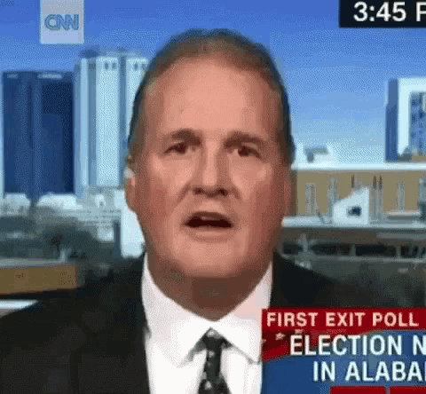 a man in a suit and tie is talking about the first exit poll for the election in alabama .
