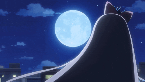 a full moon is visible in the night sky above a city