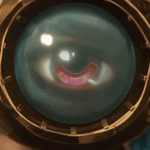 a close up of a person 's eye with a smiley face on it