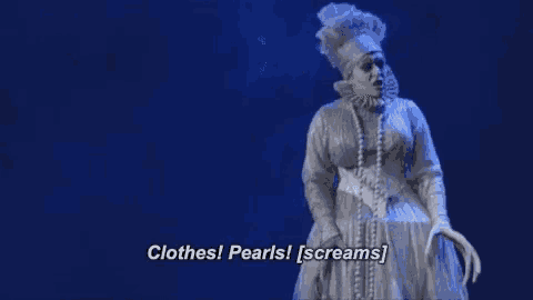 a woman in a ghost costume is screaming on a stage .