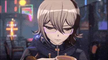 a girl with glasses is sitting at a table with a cup of coffee
