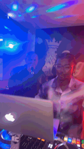 a man singing into a microphone in front of a sign that says king on it