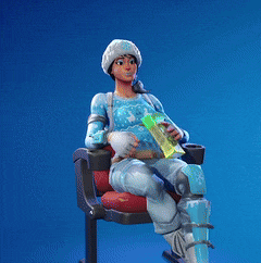 a woman in a santa hat is sitting on a chair holding a bag of chips