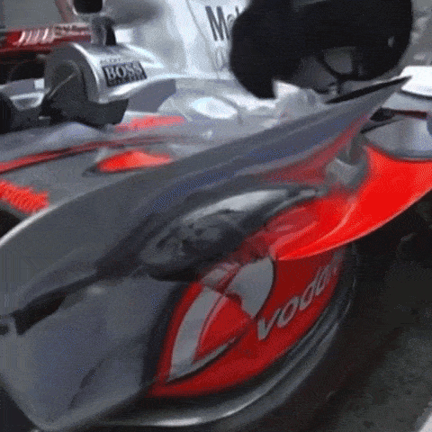 a close up of a race car with vodafone written on the side