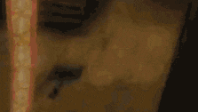a close up of a person 's face with a clock on the wall behind them .