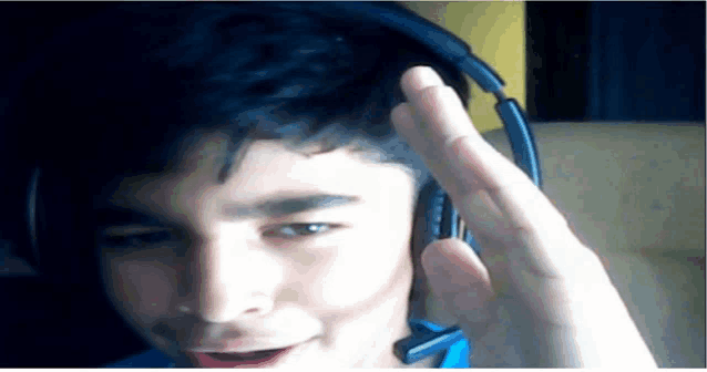 a boy wearing headphones and a microphone on his head