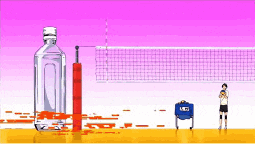 a volleyball player is standing next to a net and a bottle of water