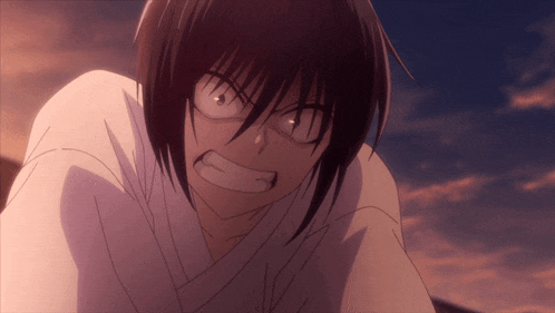 a close up of a person 's face with a very angry expression