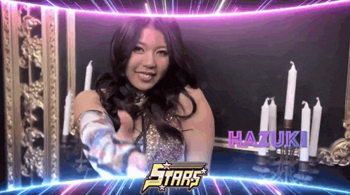 a woman giving a thumbs up in front of a sign that says stars on it