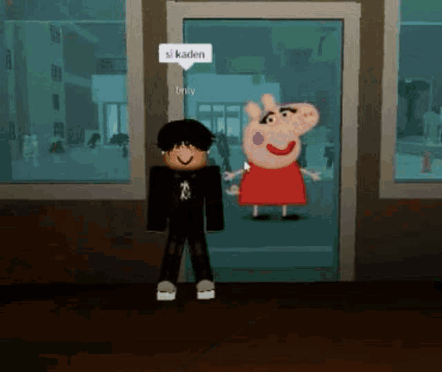 a boy and a peppa pig are standing next to each other in a room .