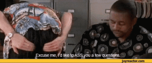 a man says excuse me i 'd like to ass you a few questions while another man looks on