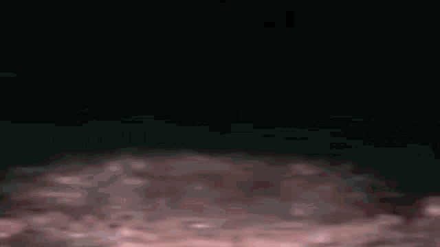 a pink background with a lot of clouds and smoke coming out of it .