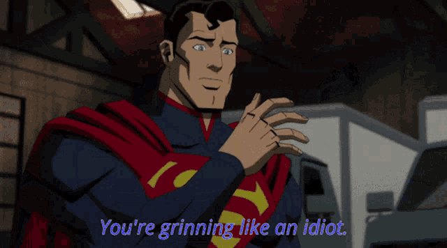 a cartoon of superman and batman with the words " you 're grinning like an idiot "