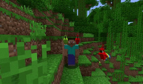 a man in a blue shirt is standing next to two parrots in a video game .