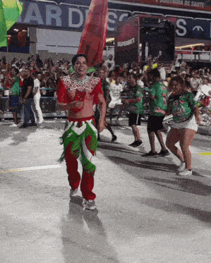 a group of people are dancing in front of a banner that says superbet