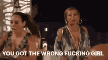 two women are standing next to each other and one of them is saying `` you got the wrong fucking girl ''